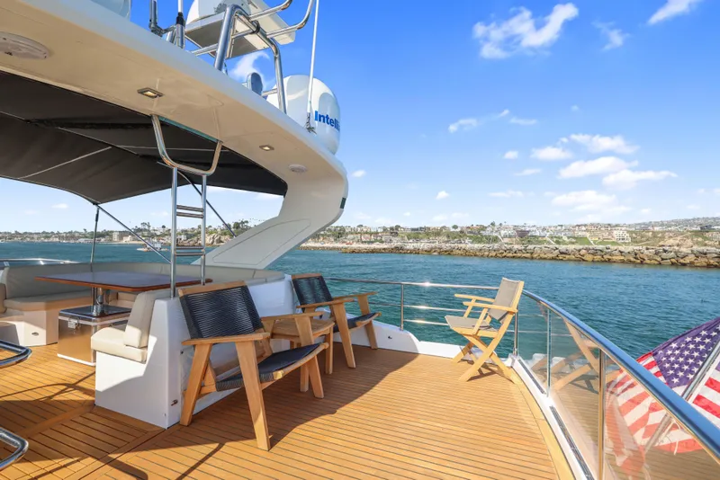 Slide: The Image of Luxurious 2015 Absolute Fly Co Ownership yacht deck with seating, overlooking serene waters. - 41