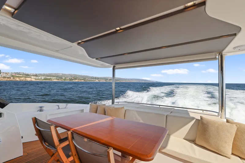 Slide: The Image of Luxurious Absolute Fly Co Ownership yacht interior, 2015 model, with ocean view and elegant seating. - 8