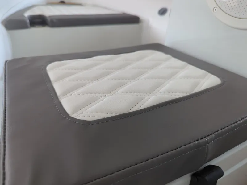 Slide: The Image of Quilted seat cushion on 2025 Tide Craft San Juan 11 boat interior. - 10