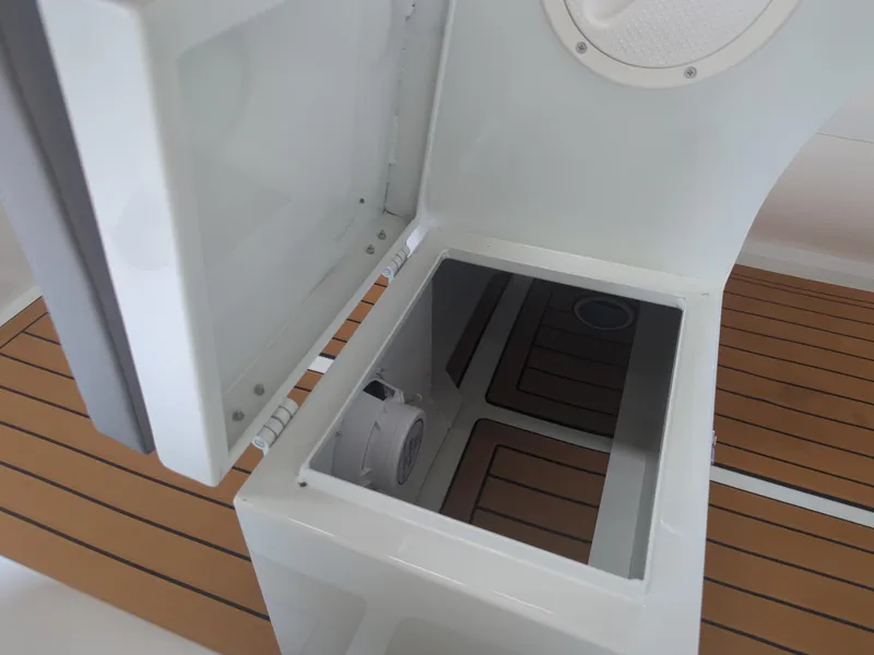 Slide: The Image of Open storage compartment on Tide Craft San Juan 11 boat, 2025 model, with wooden deck. - 9