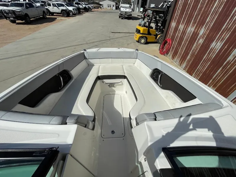 Slide: The Image of 2016 Sea Ray 240 Sundeck boat interior with spacious seating and storage. - 11