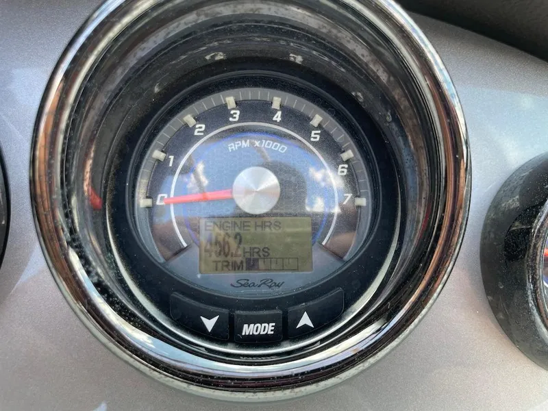 Slide: The Image of Close-up of 2016 Sea Ray 240 Sundeck tachometer displaying engine hours and RPM. - 17