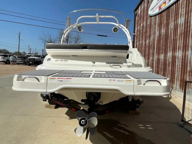 Slide: The Image of 2016 Sea Ray 240 Sundeck boat, rear view, on a sunny day. - 3