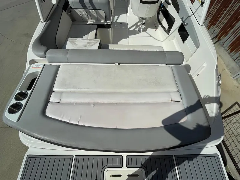 Slide: The Image of 2016 Sea Ray 240 Sundeck boat interior with seating and cup holders. - 5