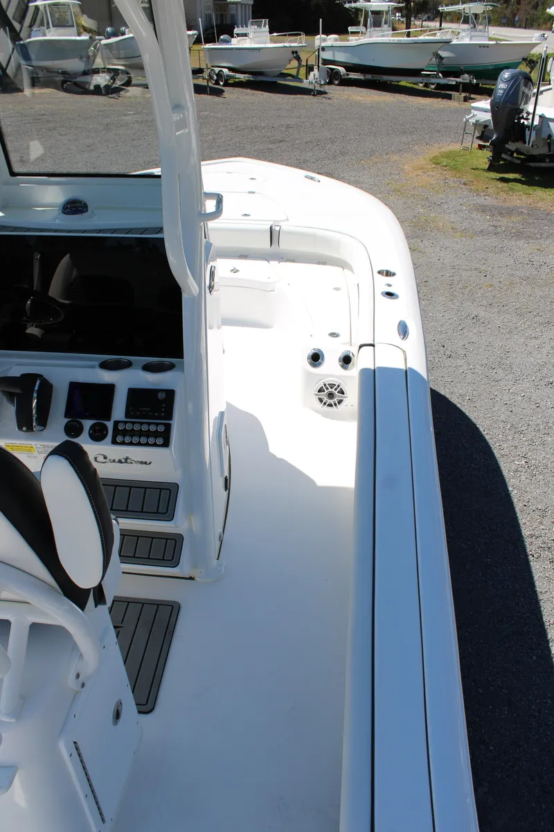 Slide: The Image of 2025 Tidewater 2500 Carolina Bay boat interior with sleek design and modern controls. - 21