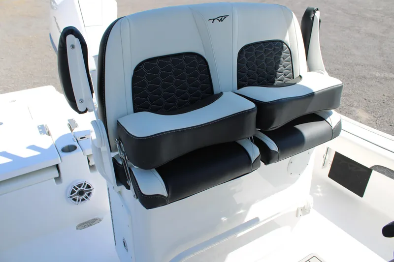 Slide: The Image of 2025 Tidewater 2500 Carolina Bay boat seats with black and white upholstery. - 23