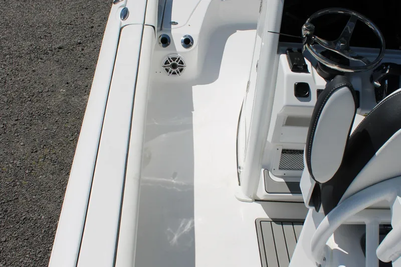 Slide: The Image of 2025 Tidewater 2500 Carolina Bay boat interior with steering wheel and seating. - 29