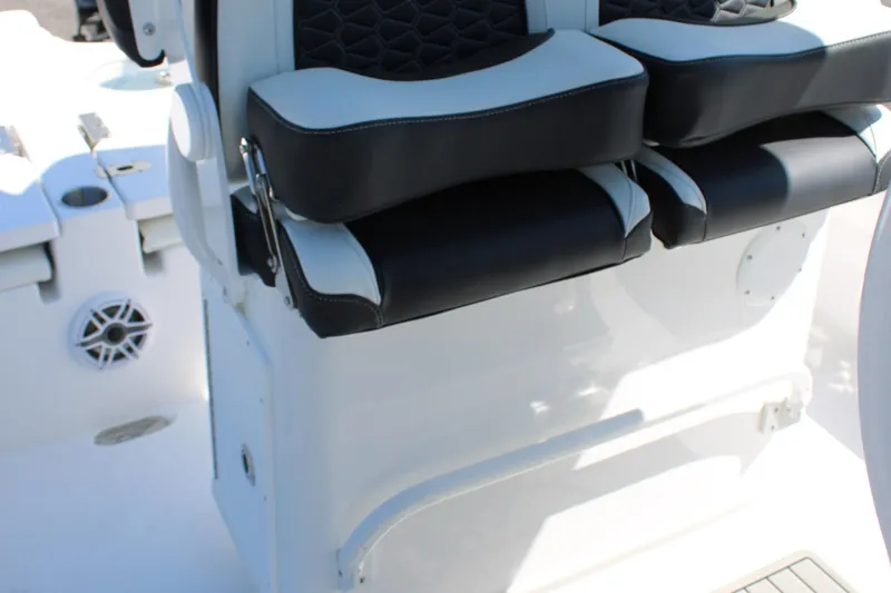 Slide: The Image of 2025 Tidewater 2500 Carolina Bay boat seats with black and white upholstery. - 30