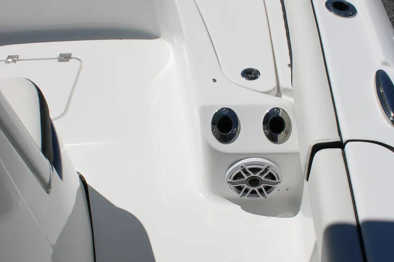 Slide: The Image of 2025 Tidewater 2500 Carolina Bay boat deck with speaker and cup holders. - 32
