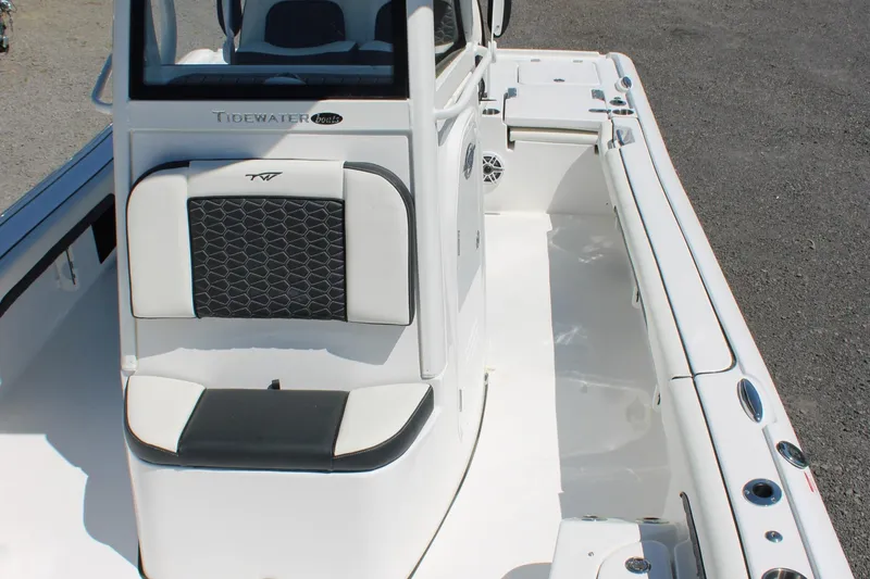 Slide: The Image of 2025 Tidewater 2500 Carolina Bay boat interior with sleek seating and modern design. - 33