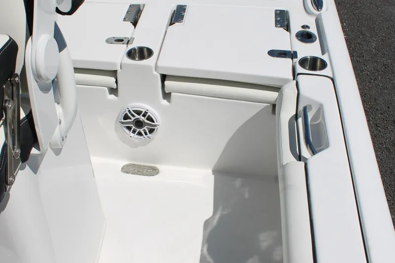 Slide: The Image of 2025 Tidewater 2500 Carolina Bay boat interior with cup holders and speaker. - 36