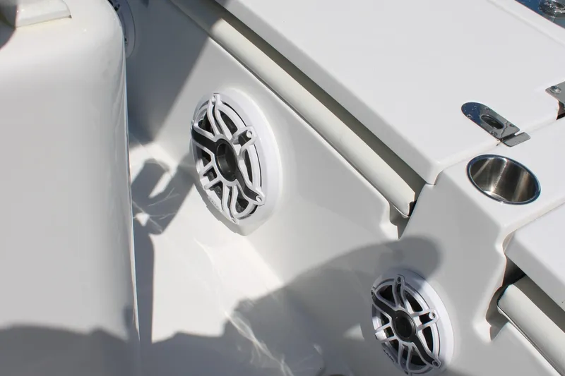 Slide: The Image of 2025 Tidewater 2500 Carolina Bay boat interior with speakers and cup holder. - 37