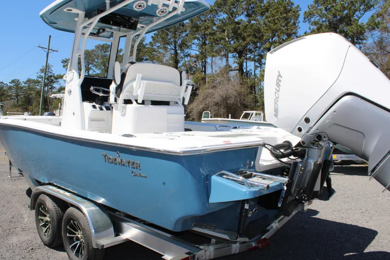 Slide: The Image of 2025 Tidewater 2500 Carolina Bay boat on trailer, featuring a powerful outboard motor. - 5