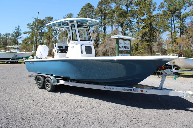 Slide: The Image of 2025 Tidewater 2500 Carolina Bay boat on trailer, parked outdoors. - 7