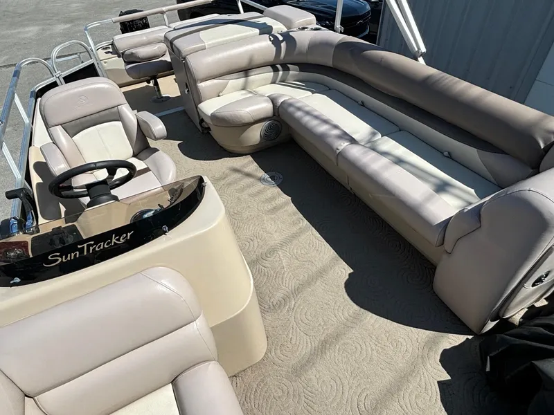 Slide: The Image of 2014 Sun Tracker Fishin' Barge 24 DLX with spacious seating and steering console. - 4