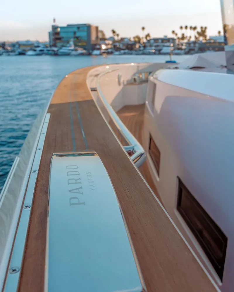 Slide: The Image of 2023 Pardo Yachts Endurance 60, elegant deck view with marina backdrop. - 11