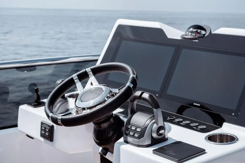Slide: The Image of Helm of 2023 Pardo Yachts Endurance 60 with modern navigation displays. - 17