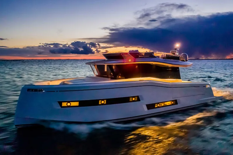 Slide: The Image of 2023 Pardo Yachts Endurance 60 cruising at sunset on open water. - 2