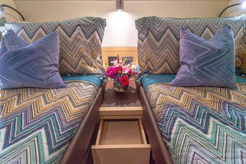 Slide: The Image of Twin beds with colorful zigzag bedding in 2023 Pardo Yachts Endurance 60 cabin. - 39