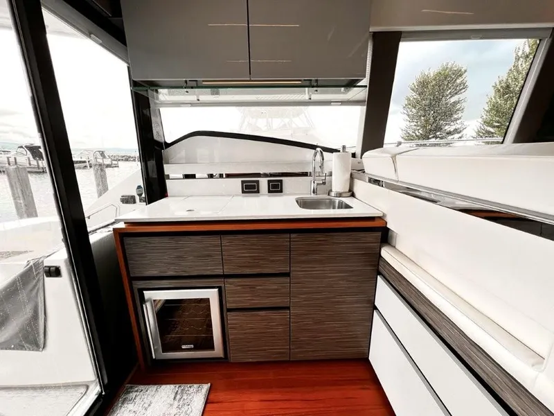 Slide: The Image of 2019 Tiara Yachts 490 Coupe interior with modern kitchen and sleek design. - 10