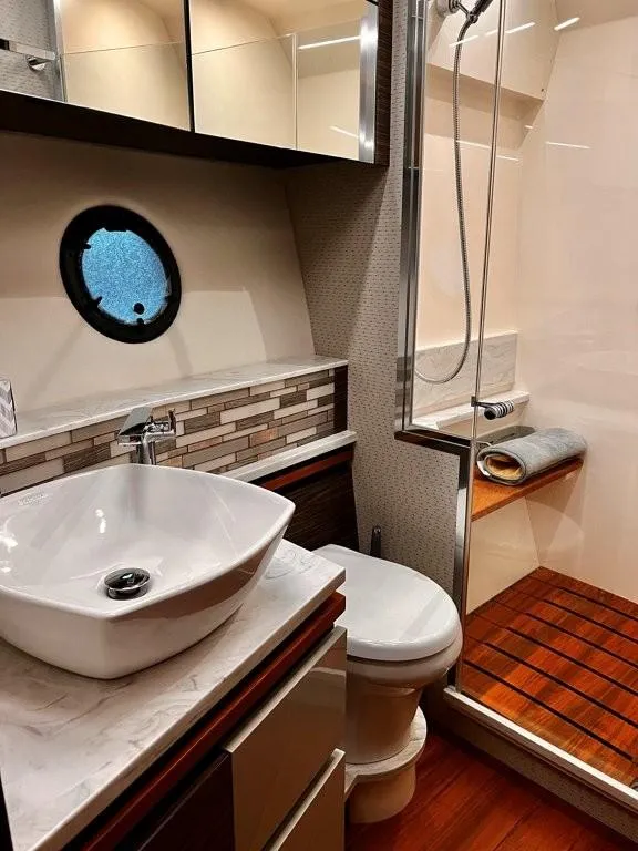 Slide: The Image of Luxurious bathroom in 2019 Tiara Yachts 490 Coupe with modern fixtures and elegant design. - 19