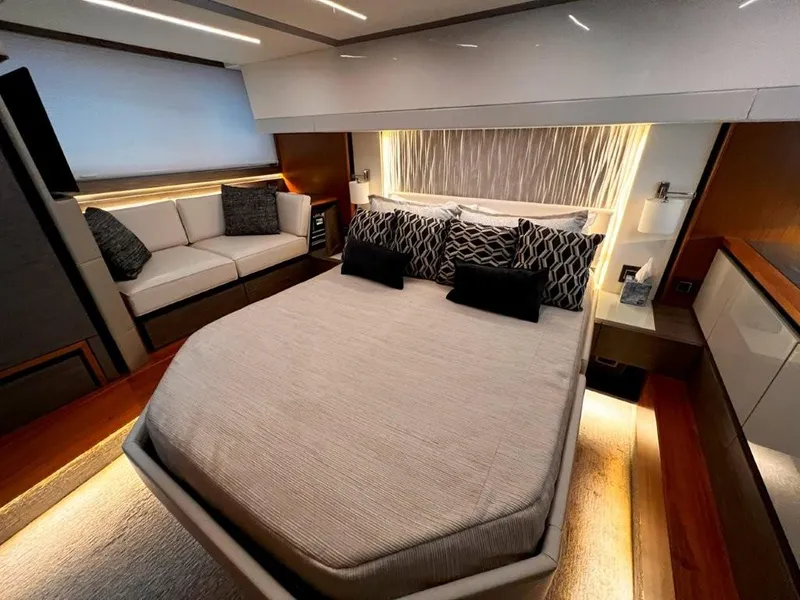 Slide: The Image of Luxurious 2019 Tiara Yachts 490 Coupe bedroom with modern decor and ambient lighting. - 21