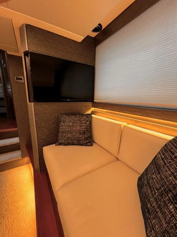 Slide: The Image of Luxurious interior of 2019 Tiara Yachts 490 Coupe with cozy seating and modern TV. - 22