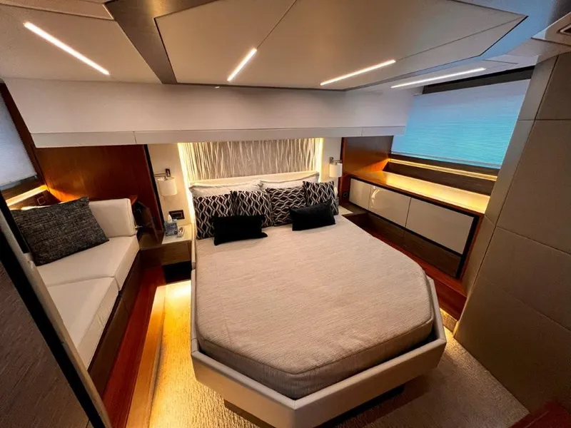 Slide: The Image of Luxurious 2019 Tiara Yachts 490 Coupe bedroom interior with modern design and ambient lighting. - 4