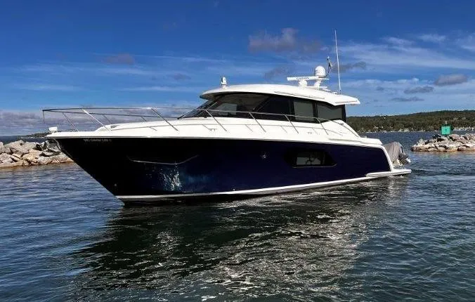 Slide: The Image of 2019 Tiara Yachts 490 Coupe cruising on a sunny day, with a sleek design and modern features. - 7
