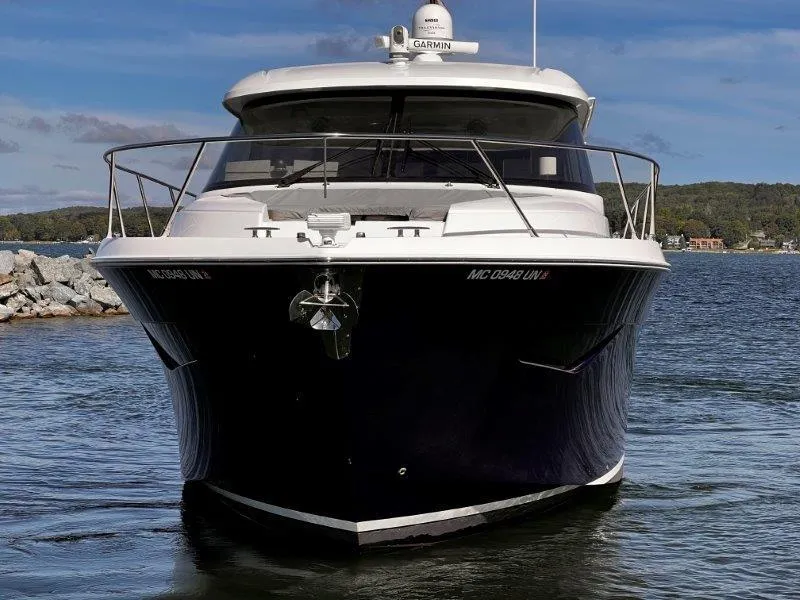 Slide: The Image of 2019 Tiara Yachts 490 Coupe on water, front view with scenic background. - 8