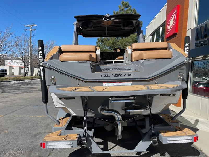 Slide: The Image of 2024 Nautique Super Air Nautique G25 Paragon boat, rear view, parked outdoors. - 4