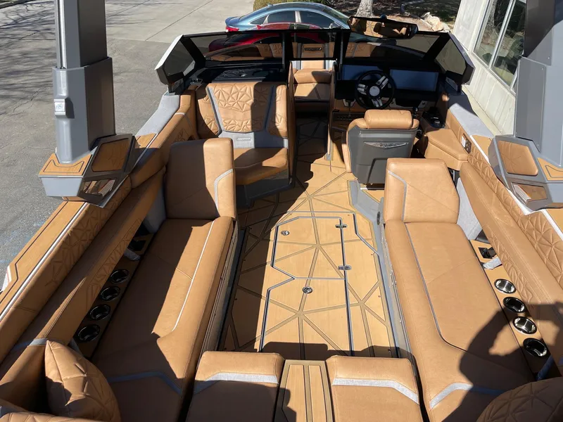 Slide: The Image of 2024 Nautique Super Air Nautique G25 Paragon interior with luxurious tan seating and modern design. - 6