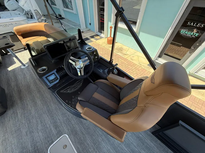 Slide: The Image of 2025 Bennington 24 MSB boat interior with luxurious captain's chair and modern dashboard. - 10
