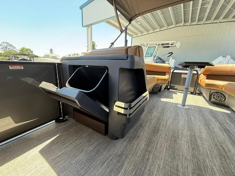 Slide: The Image of 2025 Bennington 24 MSB pontoon boat interior with seating and storage features. - 19