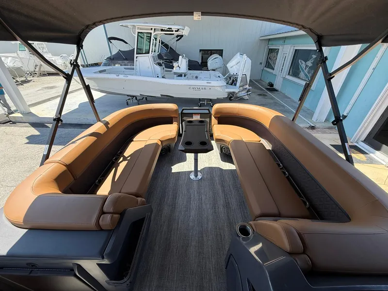 Slide: The Image of 2025 Bennington 24 MSB pontoon boat with spacious seating and modern design. - 21