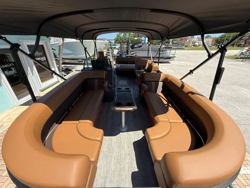 Slide: The Image of 2025 Bennington 24 MSB pontoon boat with spacious seating and canopy. - 24