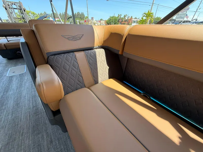Slide: The Image of Luxurious seating on 2025 Bennington 24 MSB boat with elegant brown upholstery. - 26
