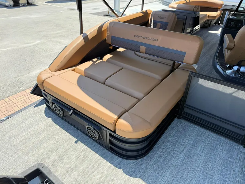 Slide: The Image of 2025 Bennington 24 MSB pontoon boat with luxurious tan seating and integrated speakers. - 5