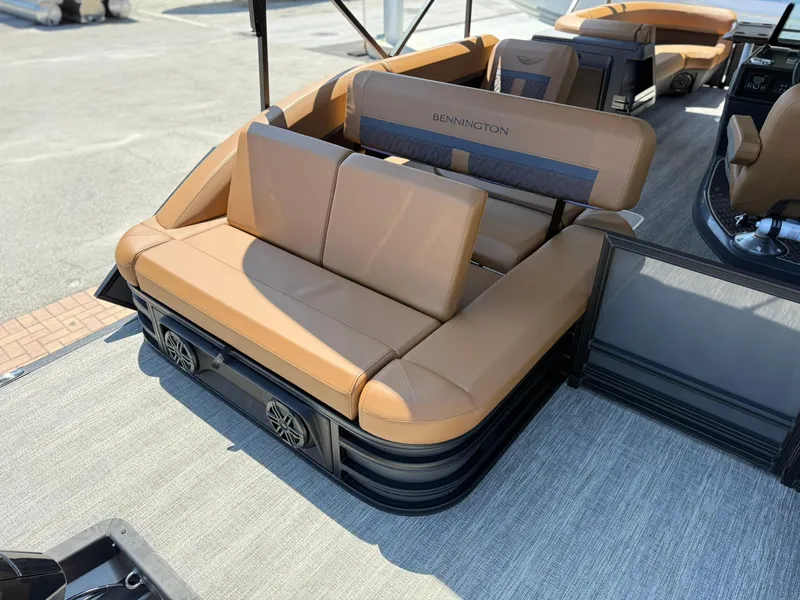 Slide: The Image of 2025 Bennington 24 MSB pontoon boat with tan seating and modern design. - 6