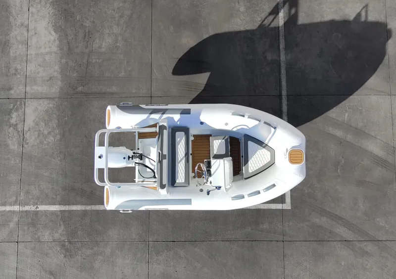Slide: The Image of Aerial view of 2025 Tide Craft Beaver 10 boat on concrete surface. - 0