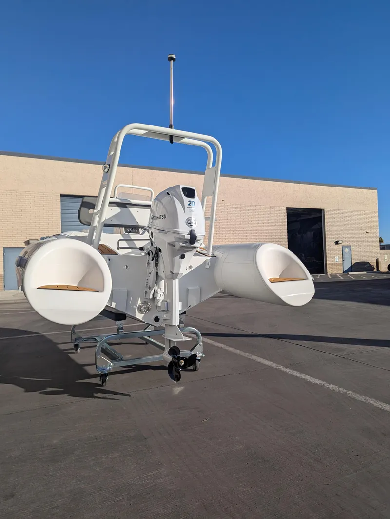 Slide: The Image of 2025 Tide Craft Beaver 10 watercraft parked outdoors on a sunny day. - 8