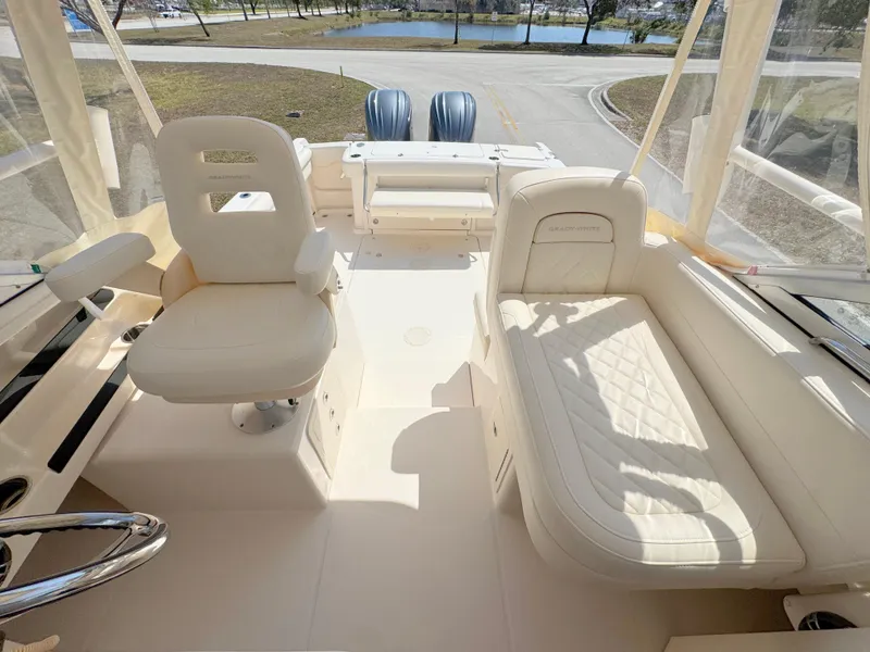Slide: The Image of 2022 Grady-White Marlin 300 boat interior with seating and helm station. - 25
