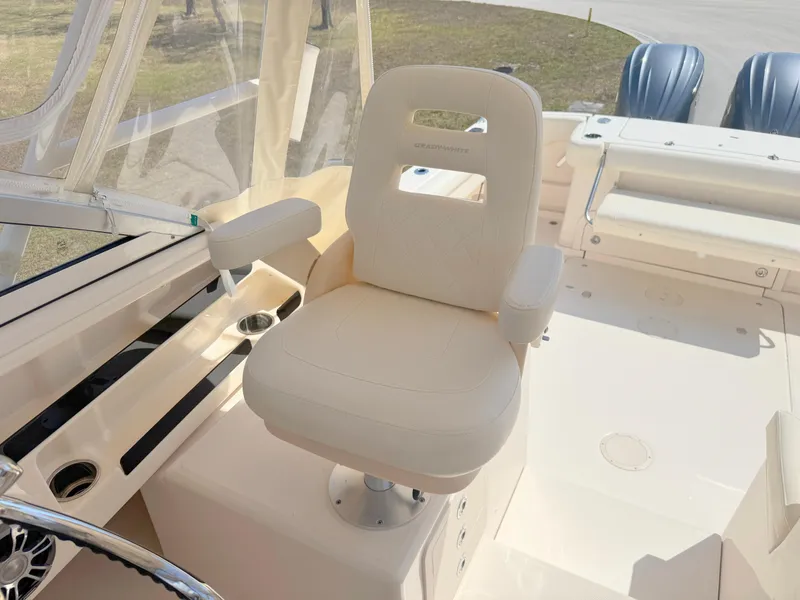 Slide: The Image of Captain's chair on 2022 Grady-White Marlin 300 boat, featuring a sleek, modern design. - 26