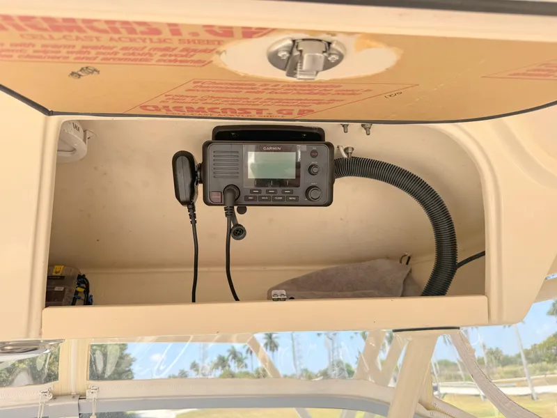 Slide: The Image of 2022 Grady-White Marlin 300 boat interior with mounted radio equipment. - 33