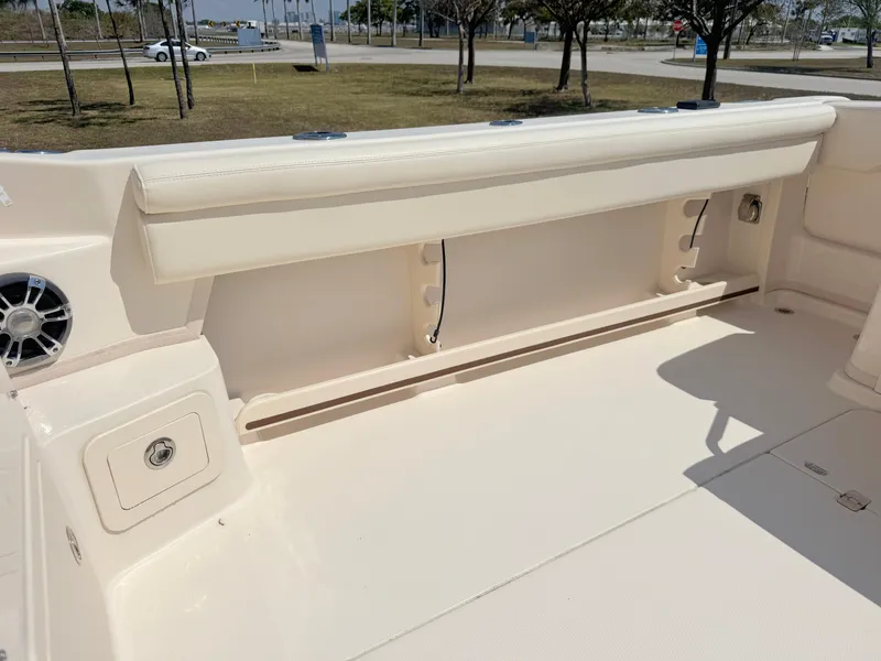 Slide: The Image of 2022 Grady-White Marlin 300 boat interior with storage compartment and speaker. - 40