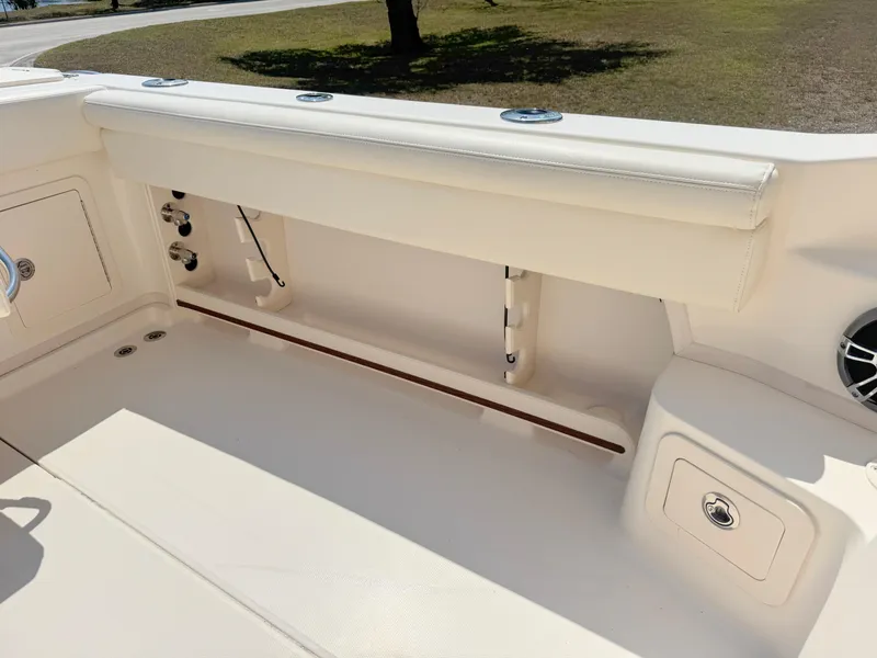 Slide: The Image of 2022 Grady-White Marlin 300 boat interior with storage compartments and seating. - 41