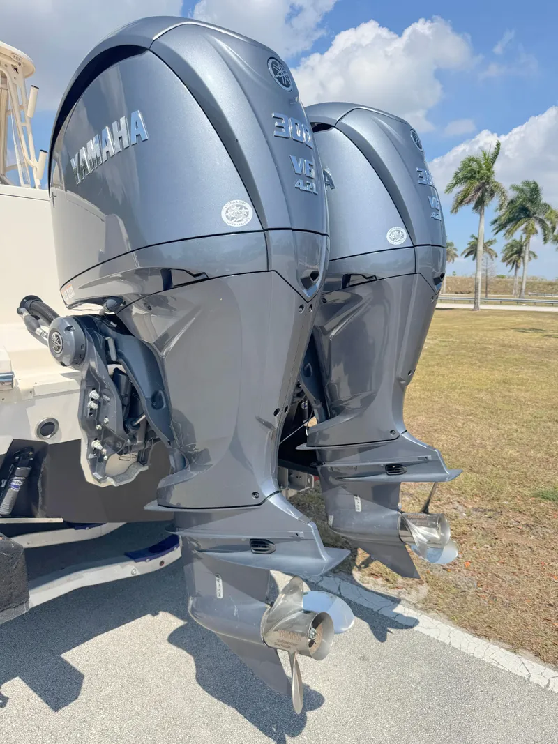 Slide: The Image of Twin Yamaha outboard engines on a 2022 Grady-White Marlin 300 boat. - 48