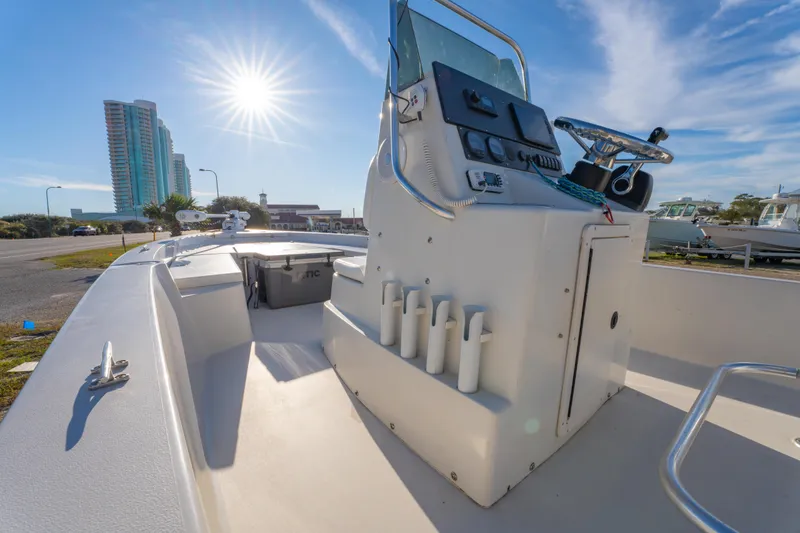 Slide: The Image of 2001 Pathfinder 2400-V boat with console, sunny day, urban background. - 16