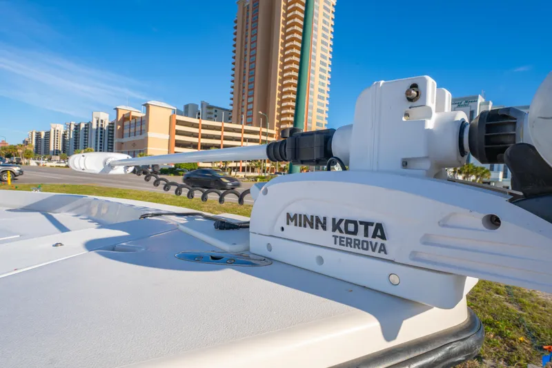 Slide: The Image of Minn Kota Terrova motor on 2001 Pathfinder 2400-V boat, cityscape background. - 8