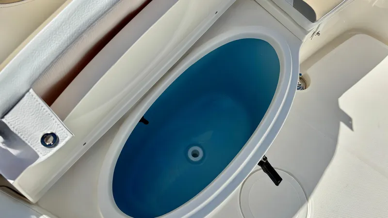 Slide: The Image of Livewell on 2025 Bulls Bay 230CC boat, featuring a blue interior. - 14